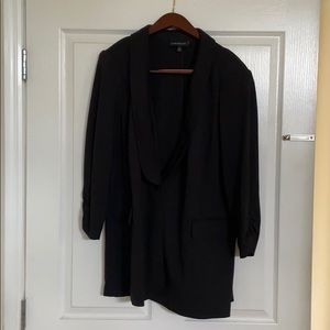 Solid black one button blazer with wide collar.